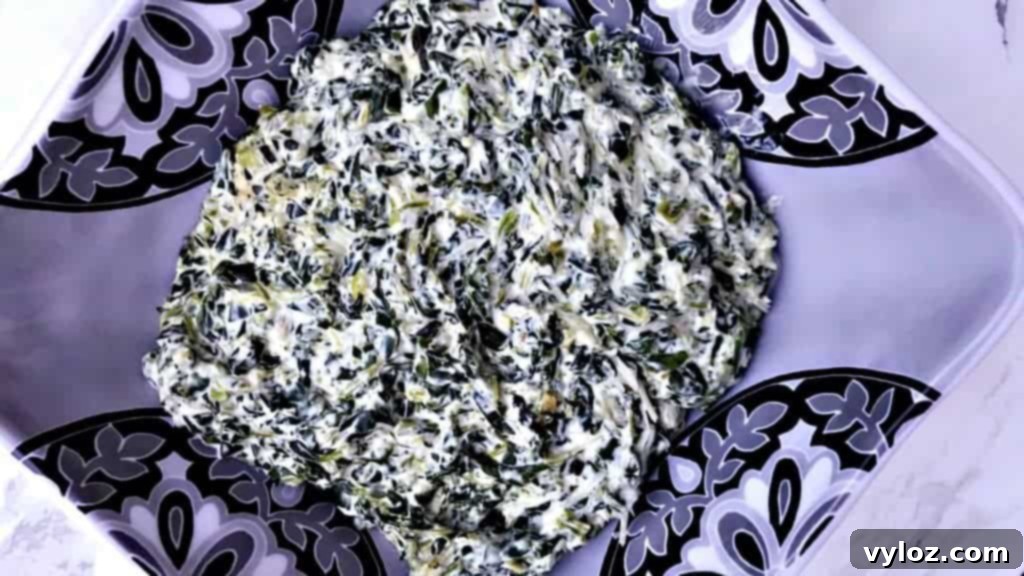 Simple Keto Creamy Garlic Spinach 6 A close-up of a serving of low-carb garlic creamed spinach, highlighting its creamy texture.