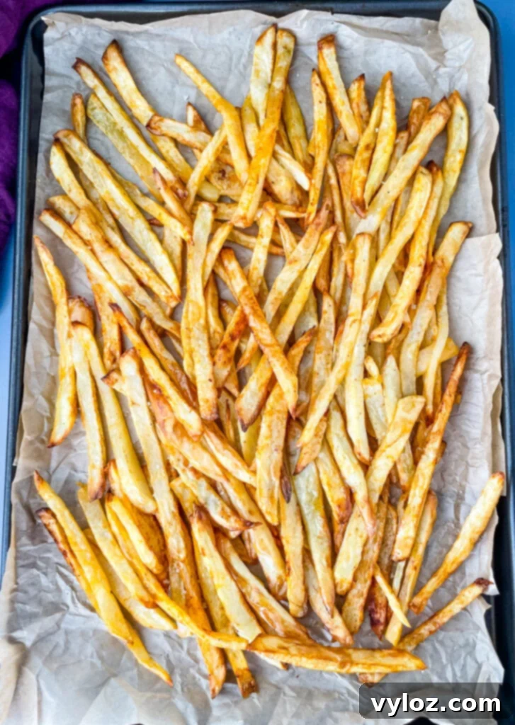cooked French fries on a sheet pan