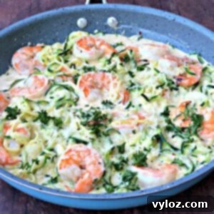 low carb zucchini alfredo in cream sauce in a skillet
