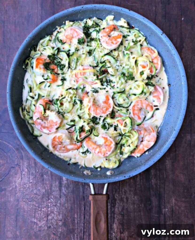 low carb zucchini alfredo in cream sauce in a skillet