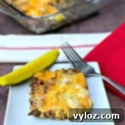 Keto Cheeseburger Bake 2 Delicious Keto Low-Carb Cheeseburger Casserole with a pickle slice on top, ready to be served