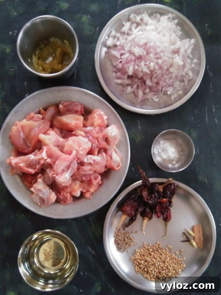 A selection of fresh ingredients and whole spices for an authentic Indian Chicken Roast