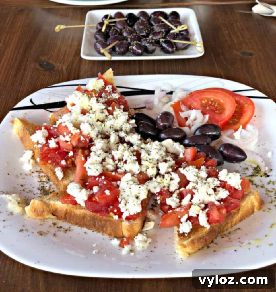 Greek bruschetta with fresh toppings on a plate