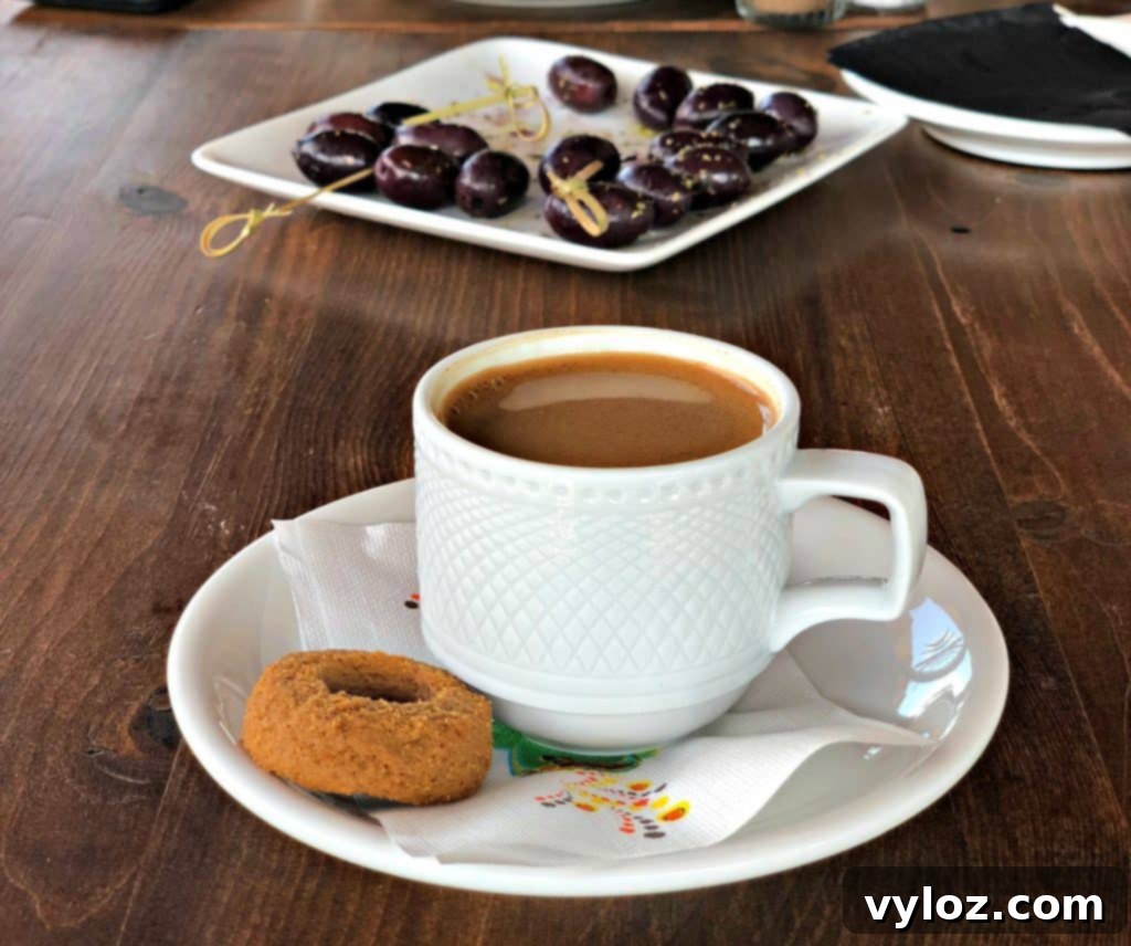 A cup of traditional Greek coffee on a table