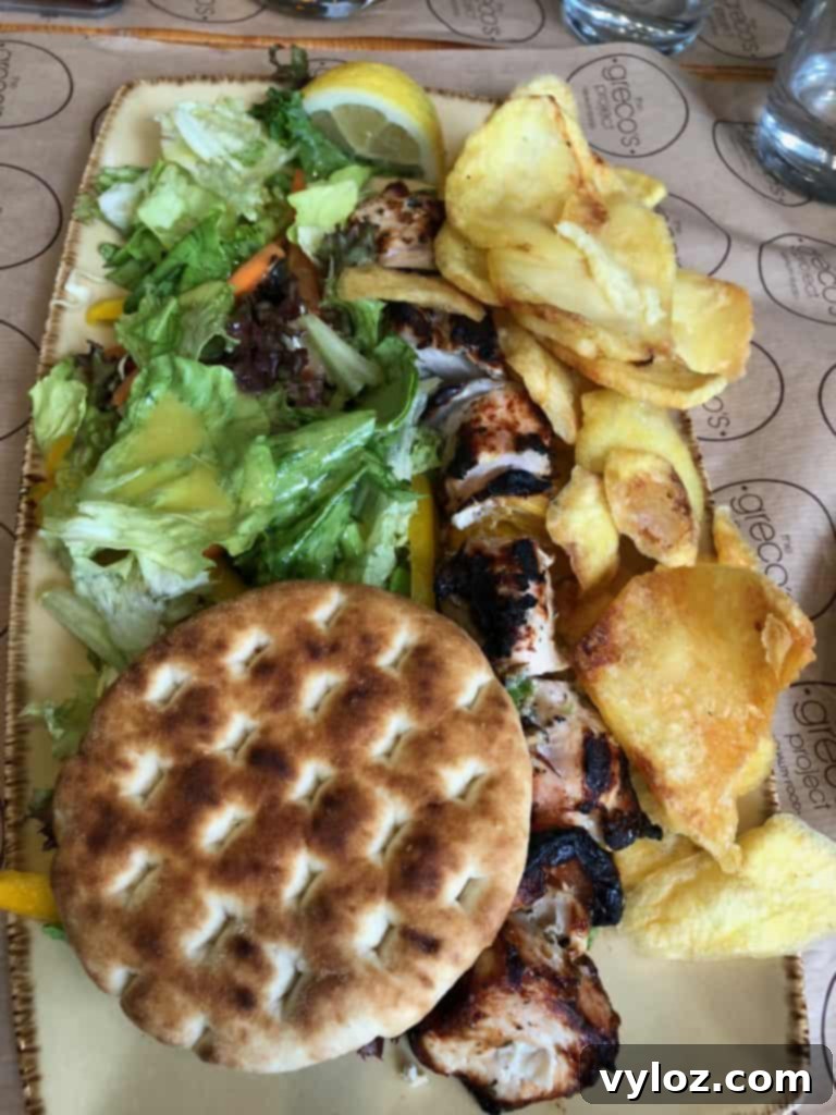 Grilled chicken plate with fries at a Greek restaurant