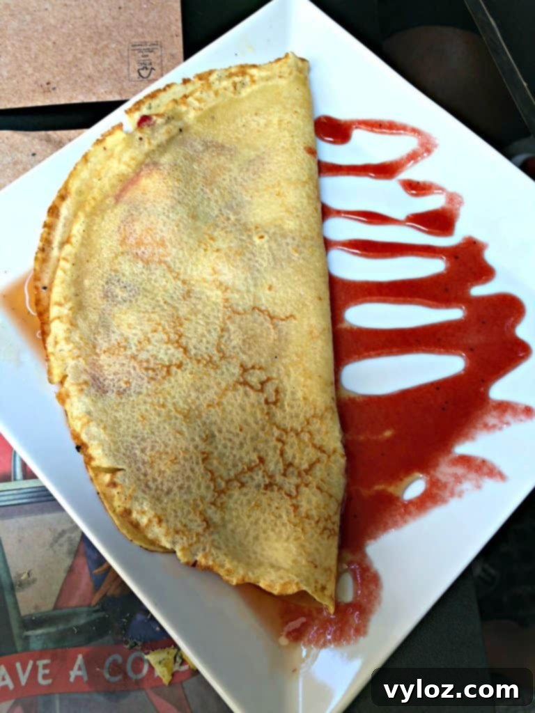 Sweet crepe with honey and fresh strawberries