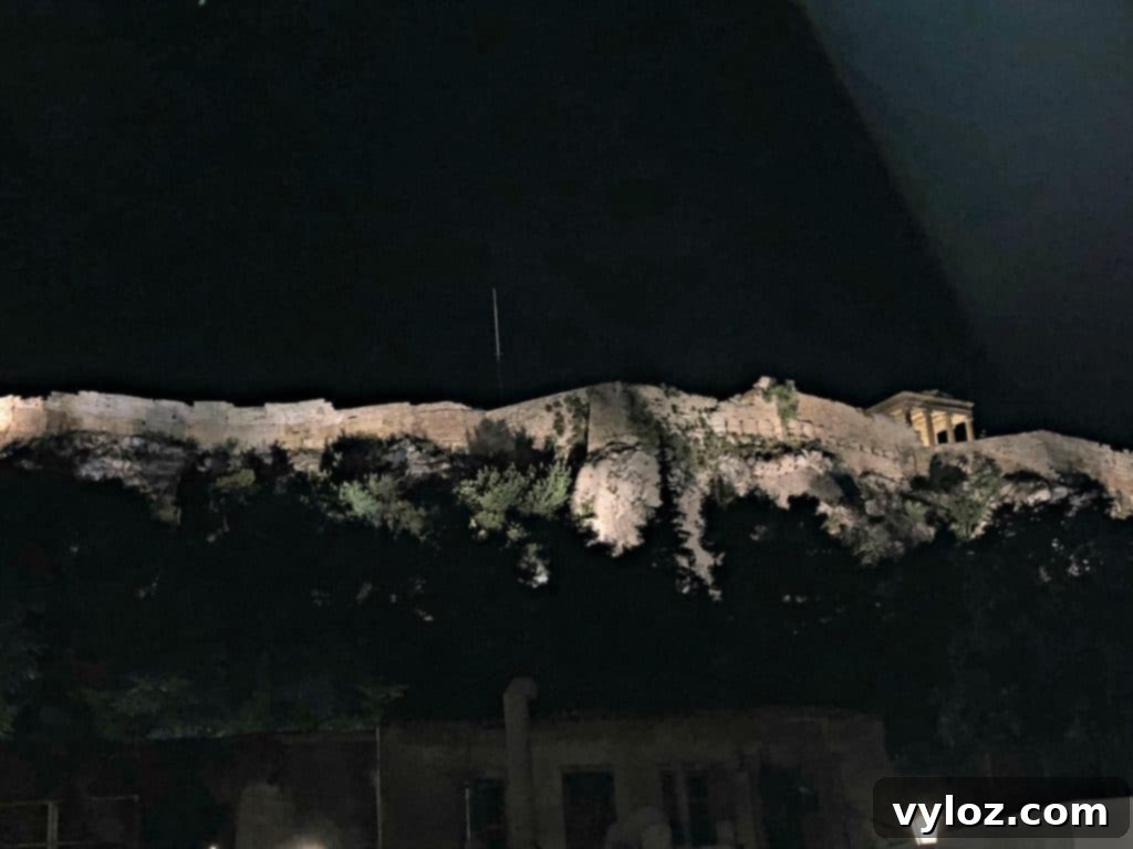 Illuminated Acropolis at night, viewed from a distance