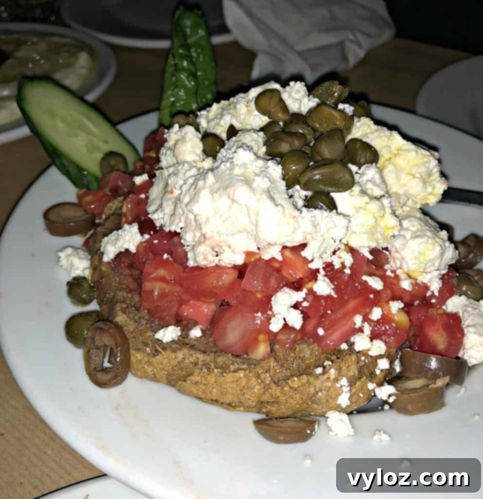 Variety of Greek appetizers including fried feta and tzatziki