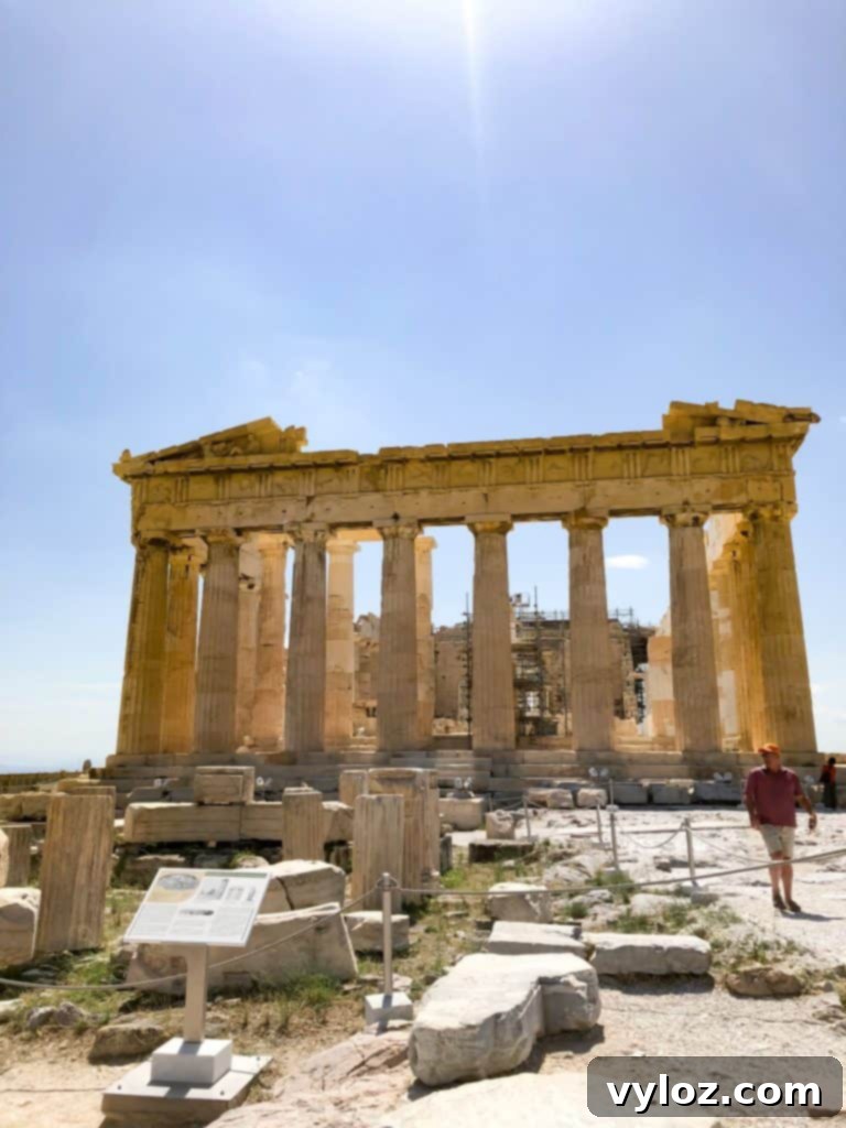 Acropolis of Athens with ancient ruins under blue sky