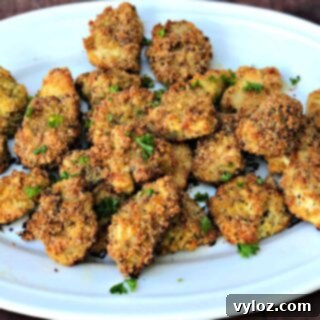 Keto Bacon Parmesan Crusted Chicken Nuggets on a white plate