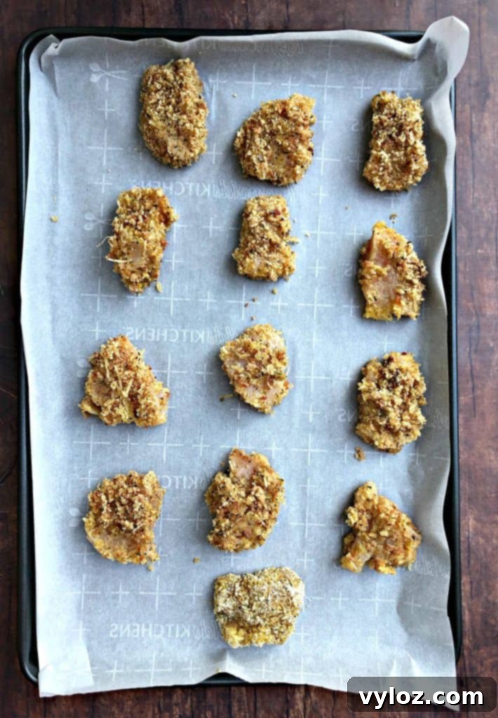 Raw breaded chicken pieces ready for cooking