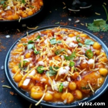 Matar chaat served in two plates, garnished beautifully.