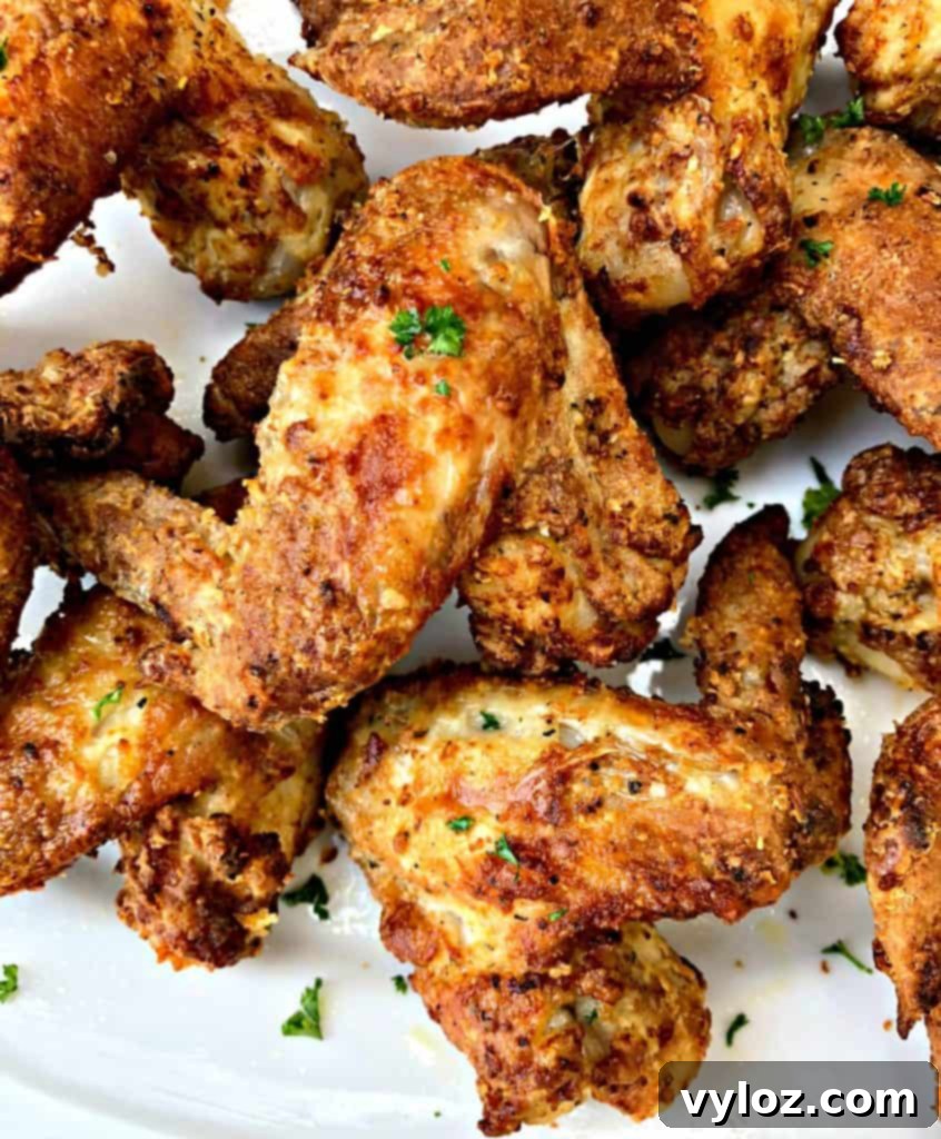 Crispy Air Fryer Buttermilk Fried Chicken 12 buttermilk fried chicken on a cutting board