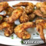 Crispy Air Fryer Buttermilk Fried Chicken 16 buttermilk southern fried chicken on a white serving platter