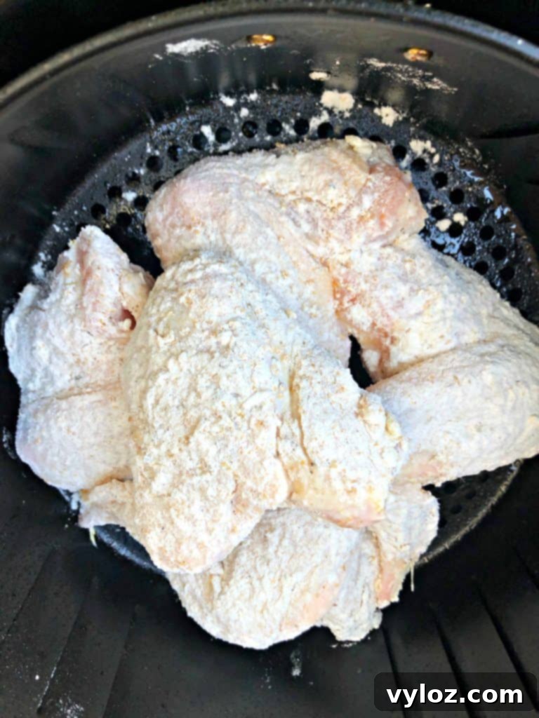 Crispy Air Fryer Buttermilk Fried Chicken 8 floured chicken wings in air fryer