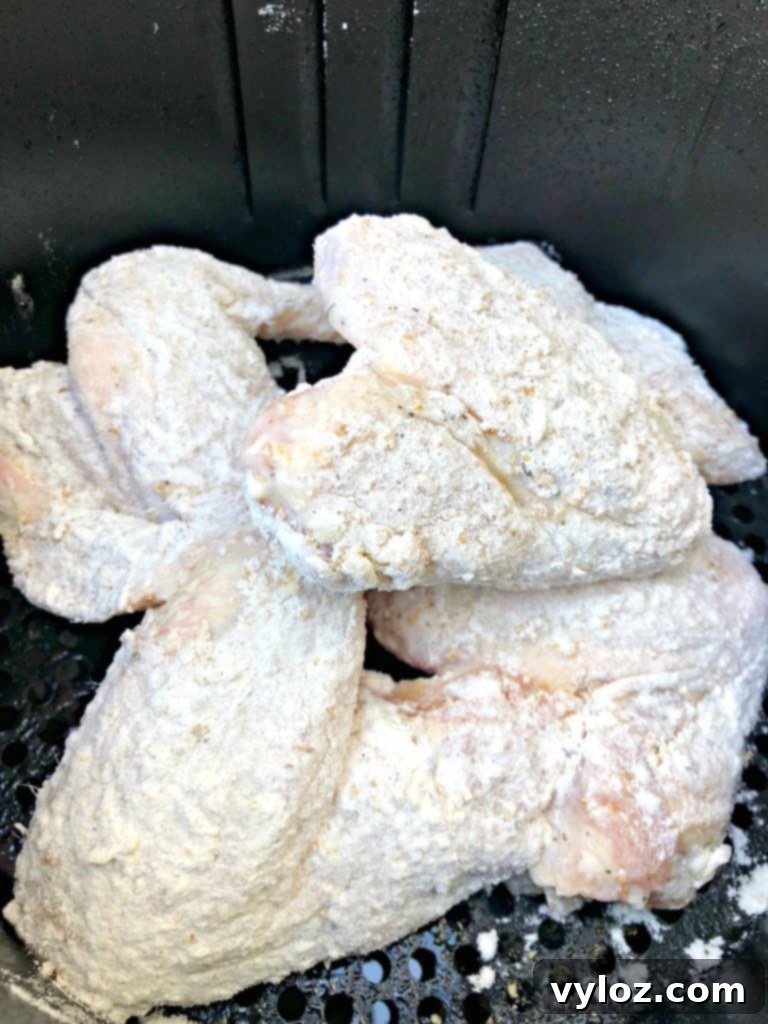Crispy Air Fryer Buttermilk Fried Chicken 9 floured chicken wings in air fryer