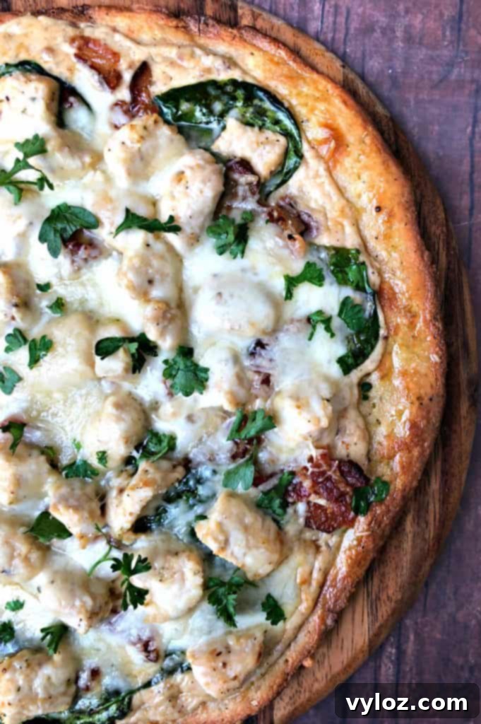 Indulgent Keto Chicken Alfredo Pizza 5 keto fathead alfredo bacon chicken pizza on a pan