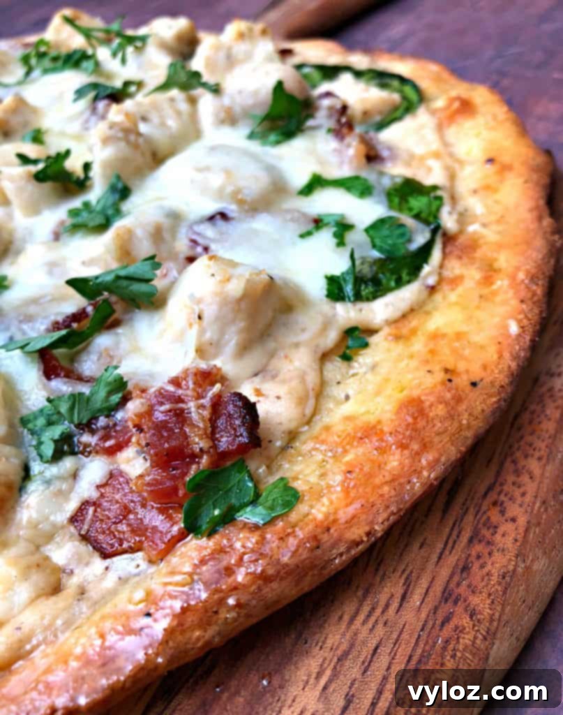 Indulgent Keto Chicken Alfredo Pizza 6 keto fathead alfredo bacon chicken pizza on a pan