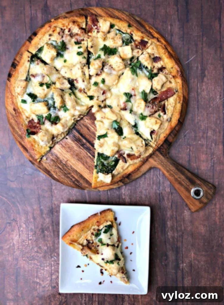 Indulgent Keto Chicken Alfredo Pizza 7 keto fathead alfredo bacon chicken pizza sliced and on a plate