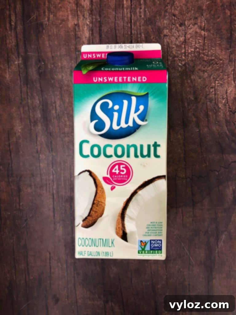 DIY Keto Low-Carb Starbucks Pumpkin Spice Latte Video Recipe 5 Close-up of an immersion blender in a pot of pumpkin spice latte mixture