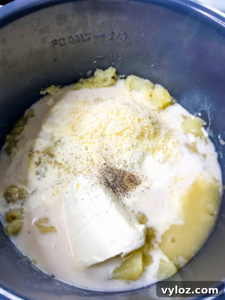 Loaded Instant Pot Baked Potato Soup 6 Uncooked potato soup ingredients inside an Instant Pot before pressure cooking