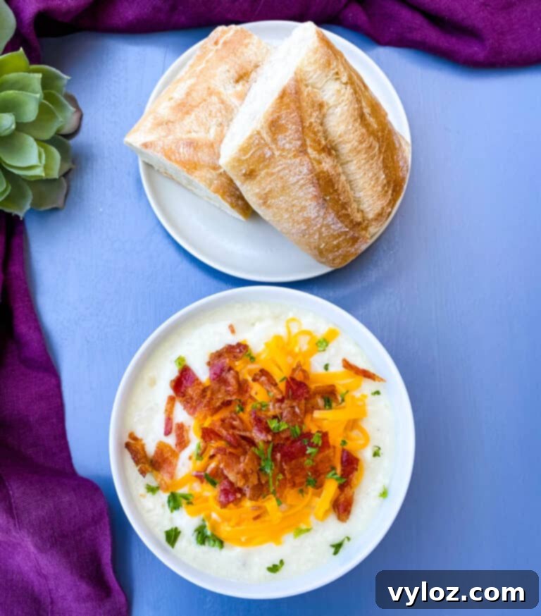 Loaded Instant Pot Baked Potato Soup 8 Close-up of three bowls of Instant Pot potato soup, generously garnished with bacon and cheese