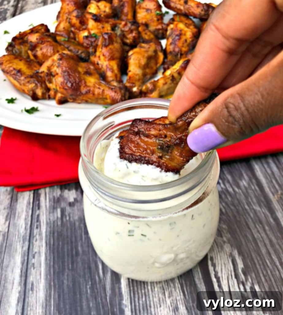 Ultimate Air Fryer Buffalo Wings 10 Air Fryer Buffalo Wings arranged beautifully with garnish