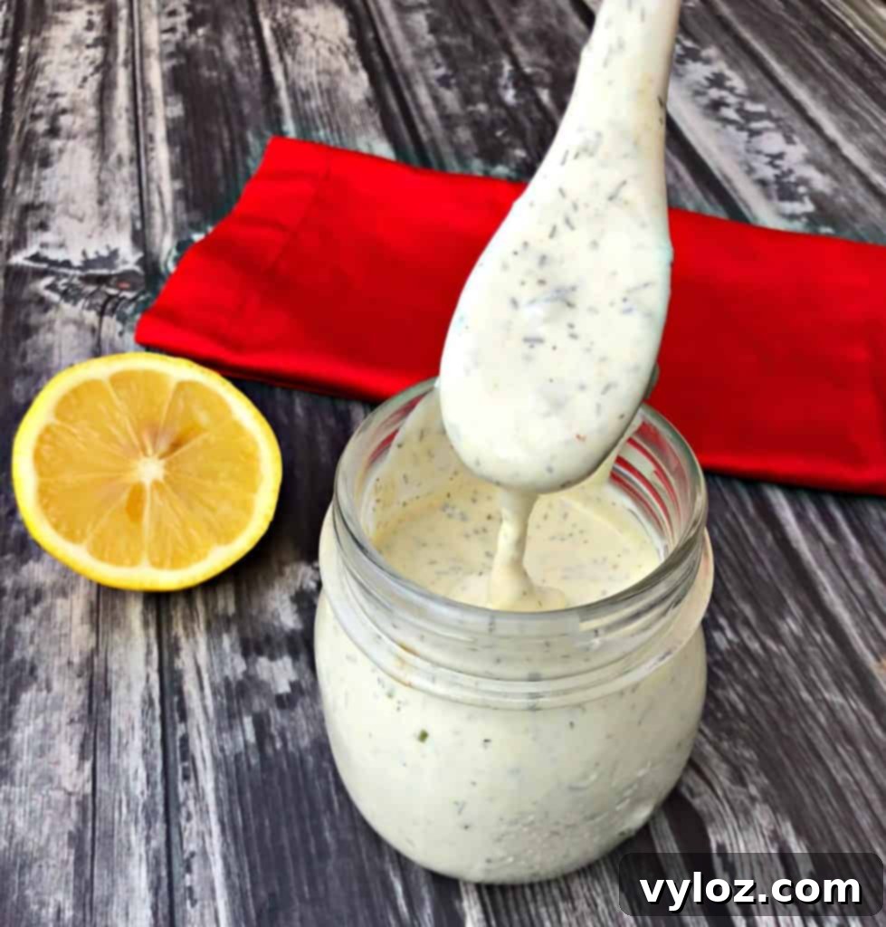 Creamy Sugar Free Ranch Dressing 2 keto low carb ranch dressing with a spoon with lemon
