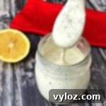 Creamy Sugar Free Ranch Dressing 9 keto ranch dressing in a glass jar with a spoon