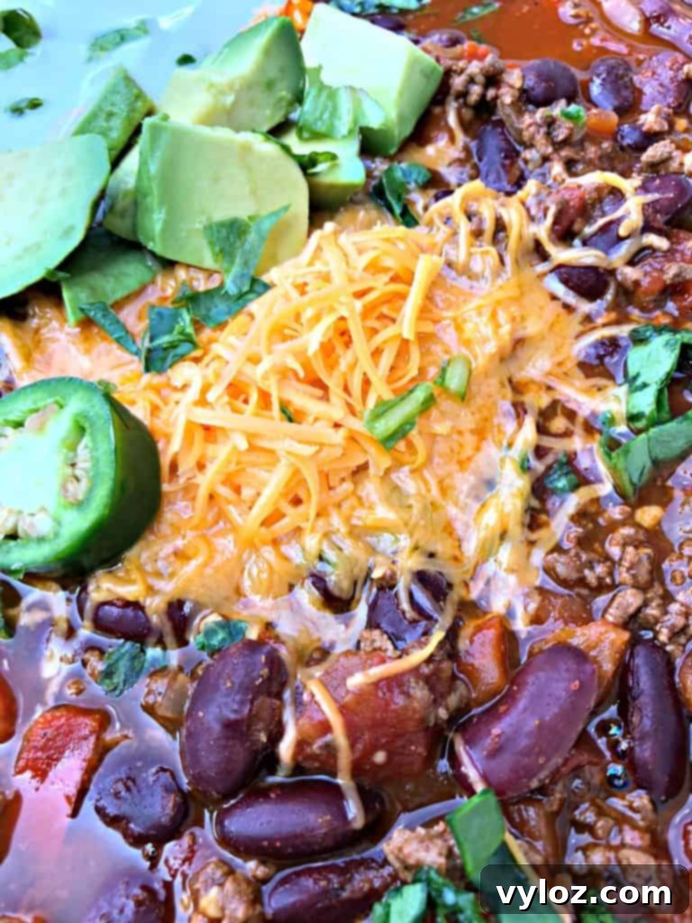 A close-up shot of rich Instant Pot beef chili simmering, showcasing its deep color and robust texture.