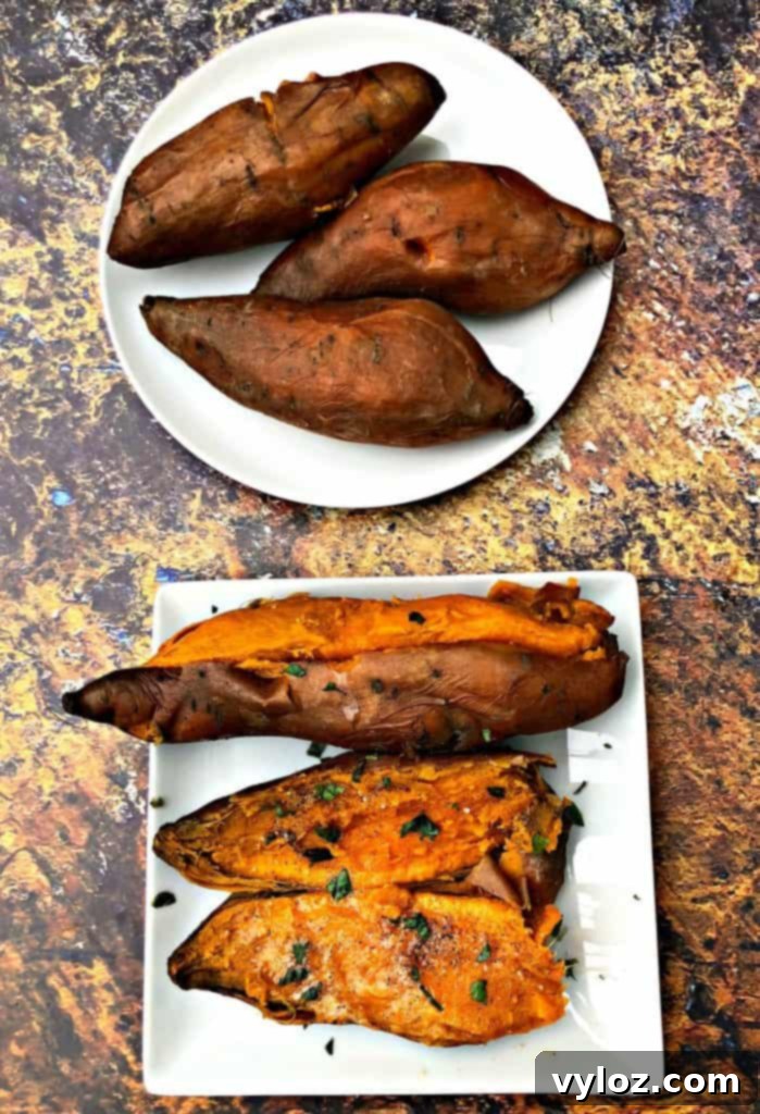 Sweet potato half with butter and seasoning on a white plate