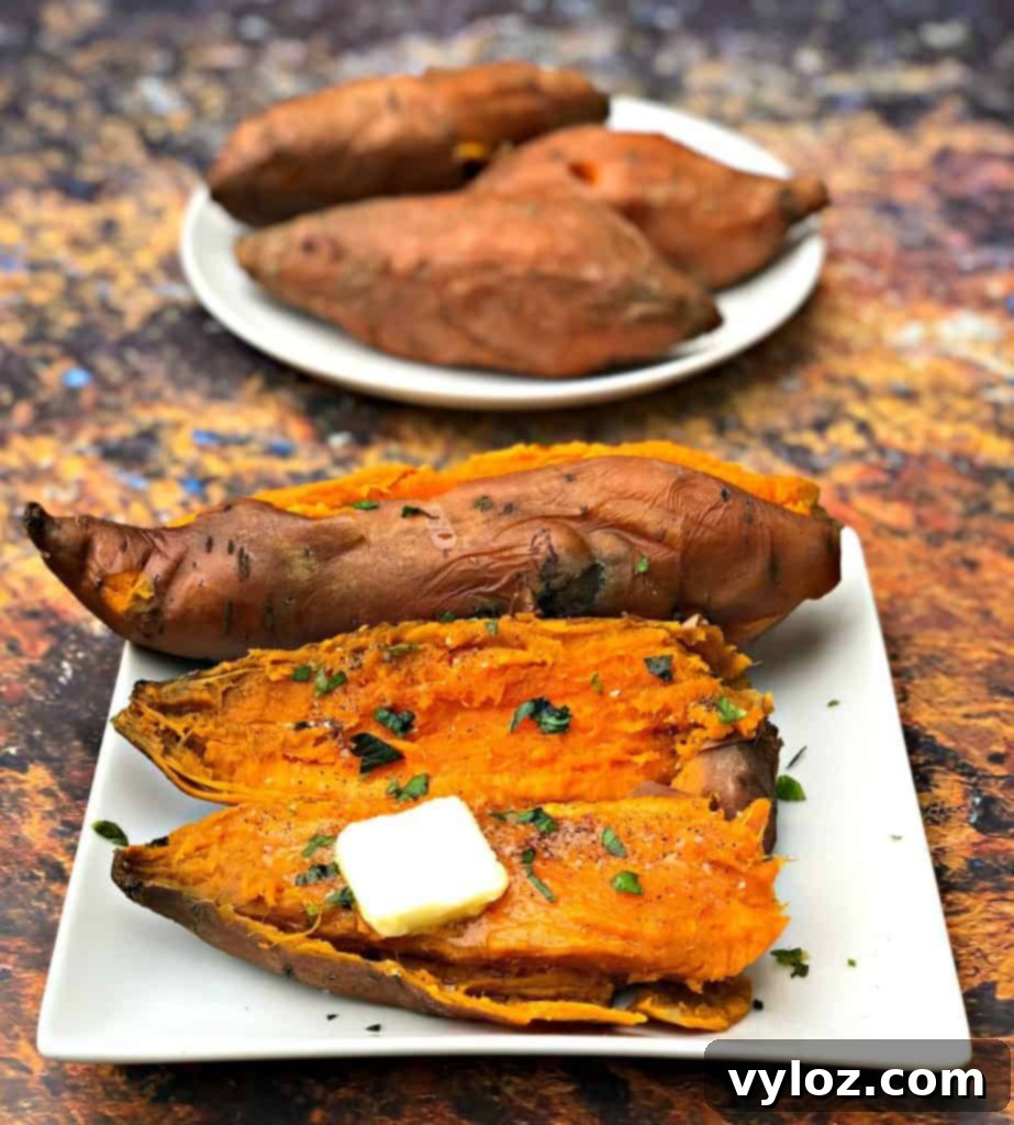 Several Instant Pot sweet potato halves on a white plate