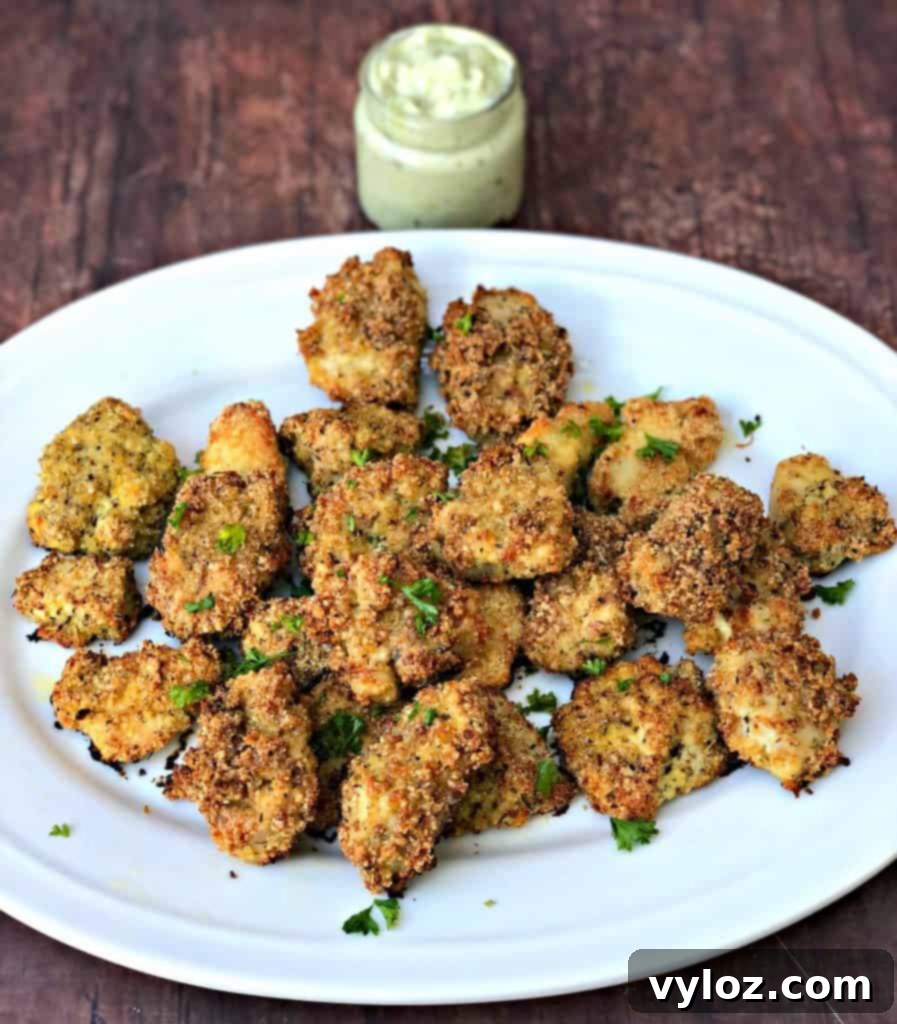 2 Keto Bacon Chicken Nuggets on a White Plate with Avocado Ranch