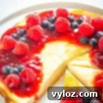 A beautifully presented keto cheesecake slice on a white plate, adorned with sugar-free caramel sauce and a dollop of fresh whipped cream.