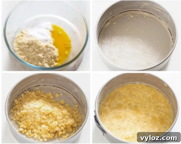 An almond flour cheesecake crust pressed into a springform pan, pre-baked and ready for the filling.