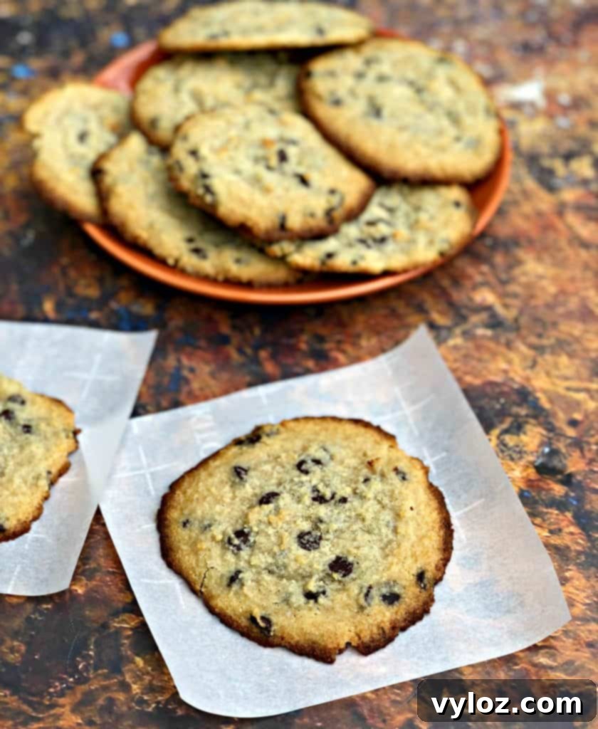 keto chocolate chip cookies on a plate with a glass of milk