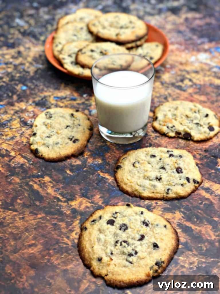 keto chocolate chip cookies on a plate with a glass of milk